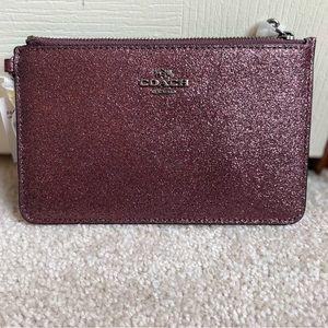 Coach metallic cherry small wristlet.
